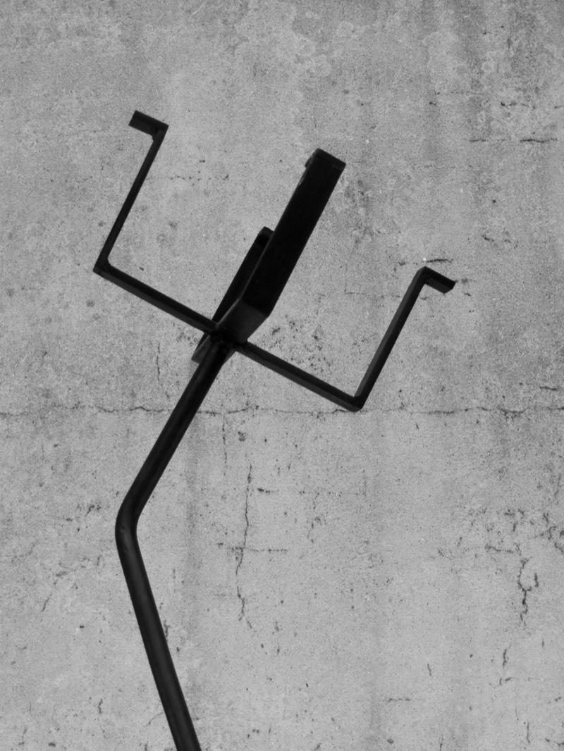 Angled detail of the crown arms of the forged steel figure.